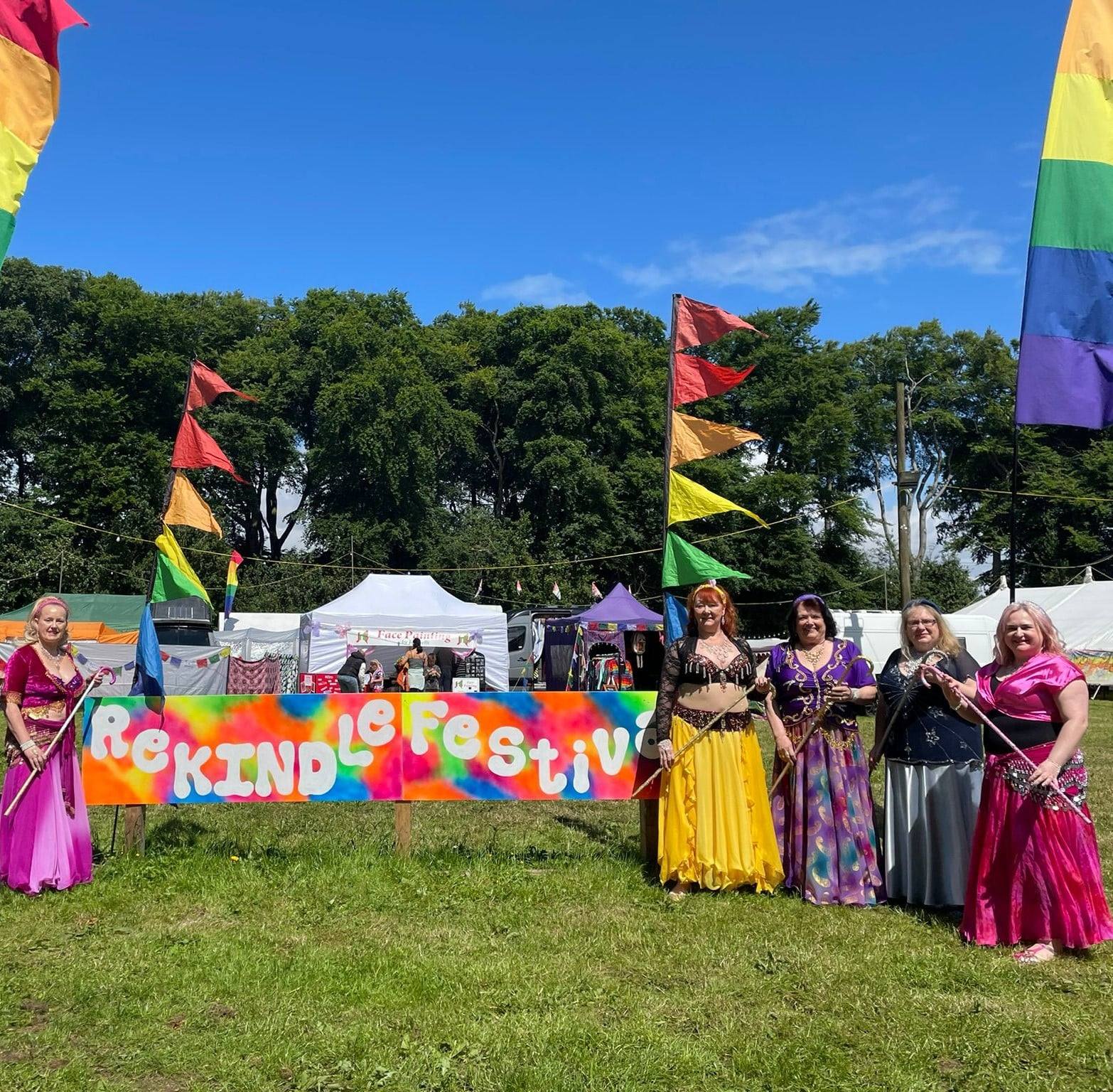 Dancing Gems in colourful costumes at ReKINDle Festival.