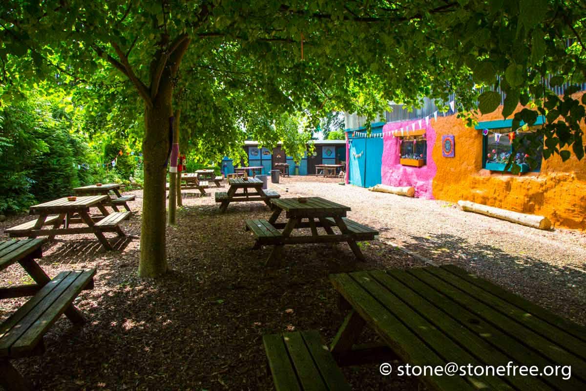 Quiet woodland seating area at ReKINDle Festival.