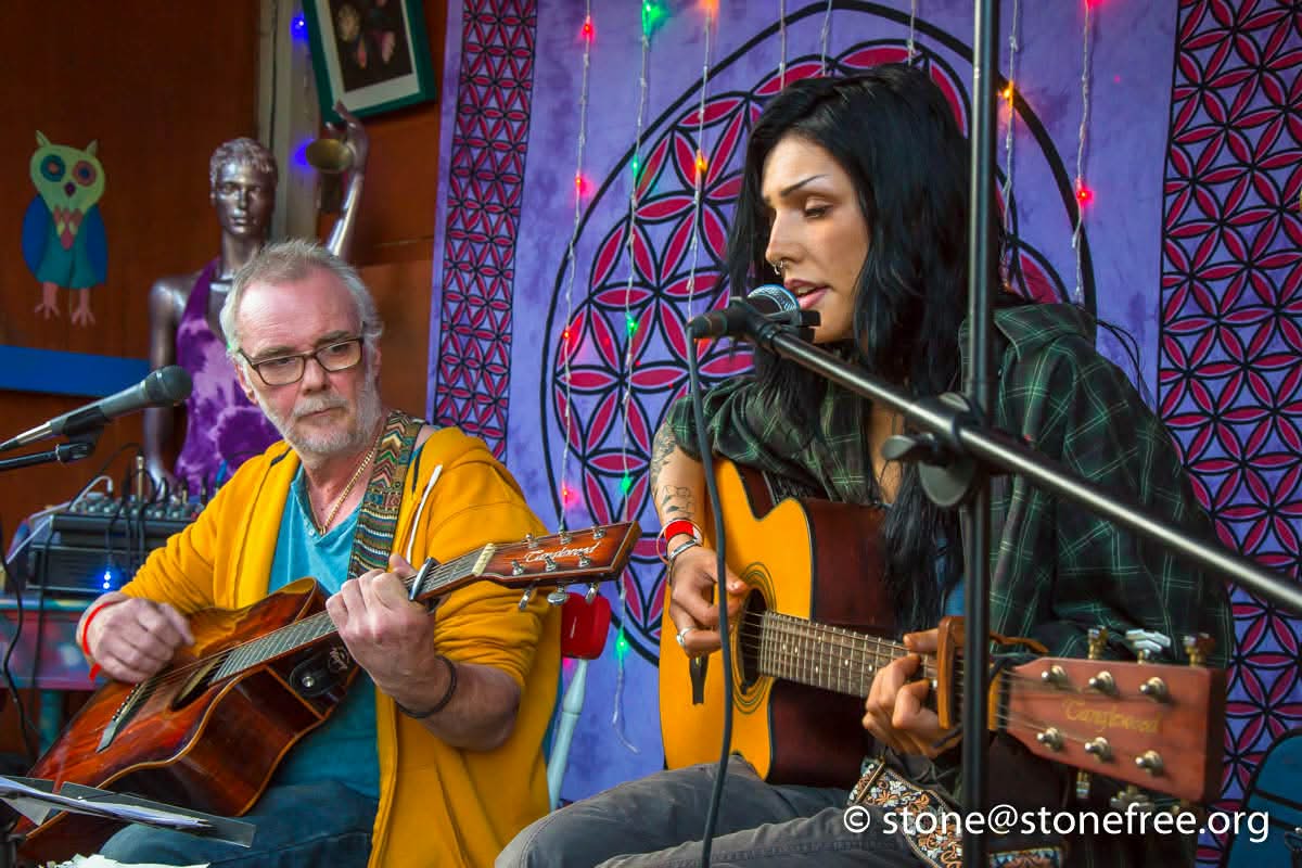 Acoustic musicians performing together at ReKINDle Festival.