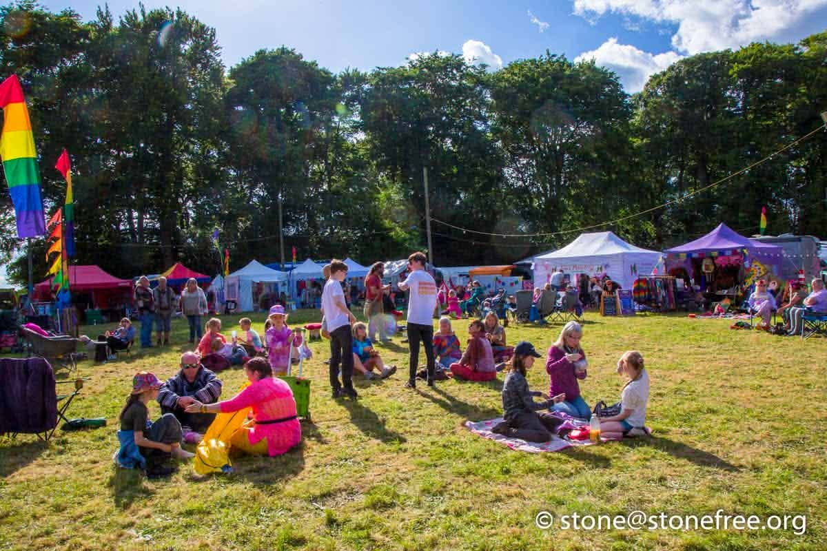 Families relaxing on the festival field.